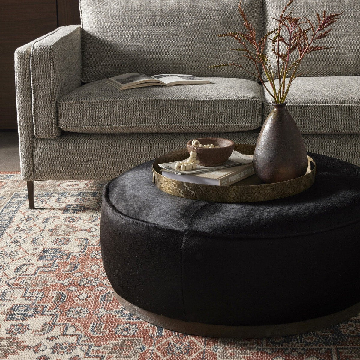 Sinclair Large Round Ottoman - Dark Hair on Hide