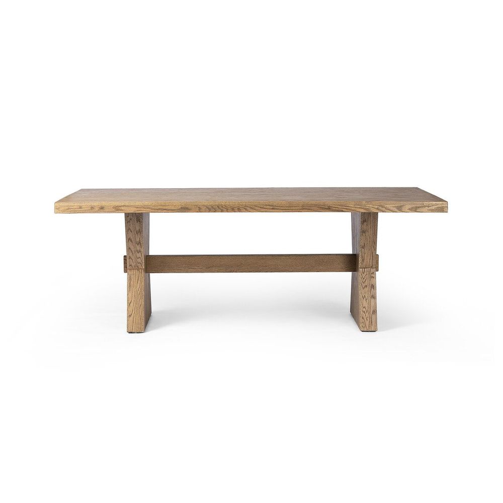 Tia Dining Table 84", shown in light brown and natural oak with solid oak, oak veneer, and a trestle base.