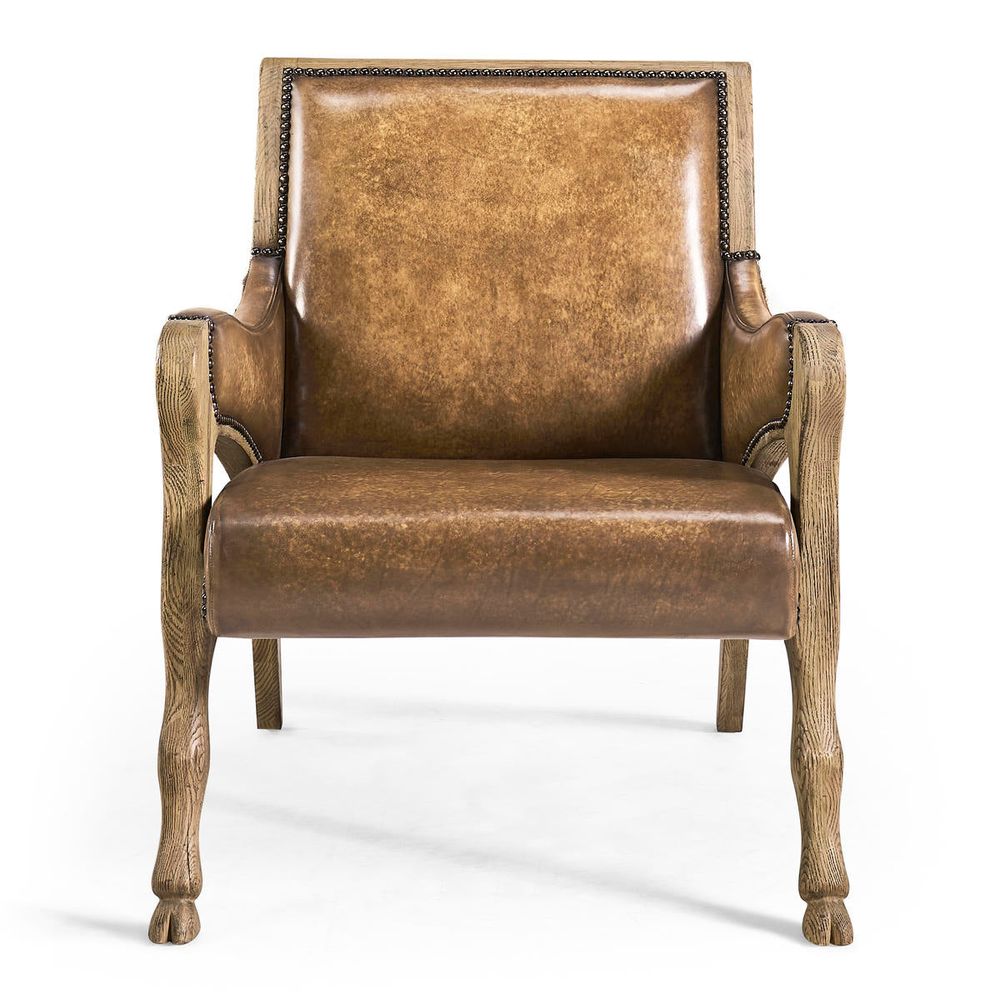 Echo Canyon Leather & Hide Occasional Chair, shown in cognac brown and light oak with leather, cowhide, and fixed arms.
