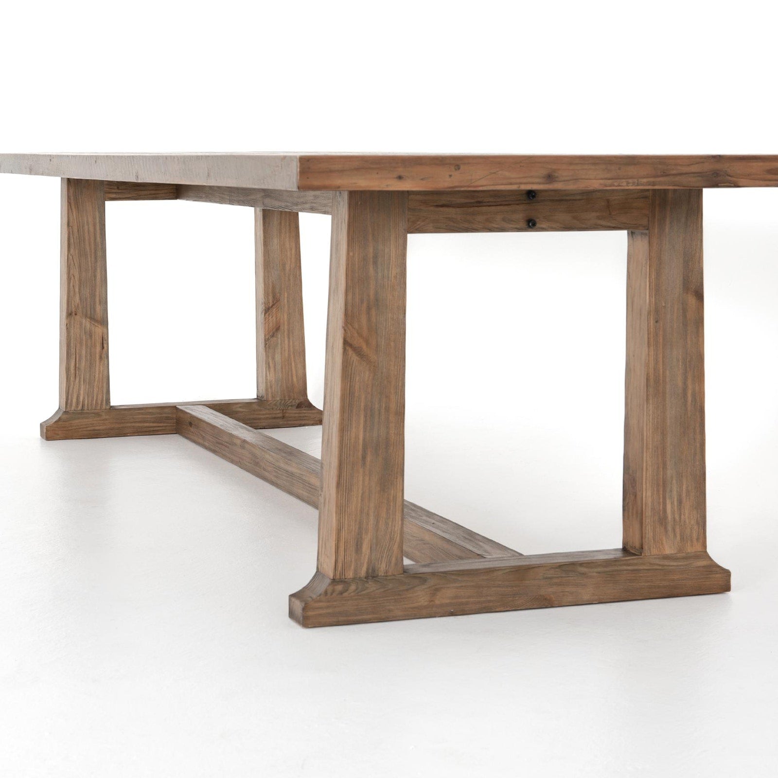 Detail of the reclaimed pine trestle base and stretcher on the Four Hands Otto Dining Table